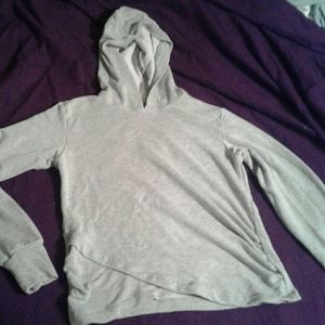Gray hoodie with overlap hem and thumb hole detail